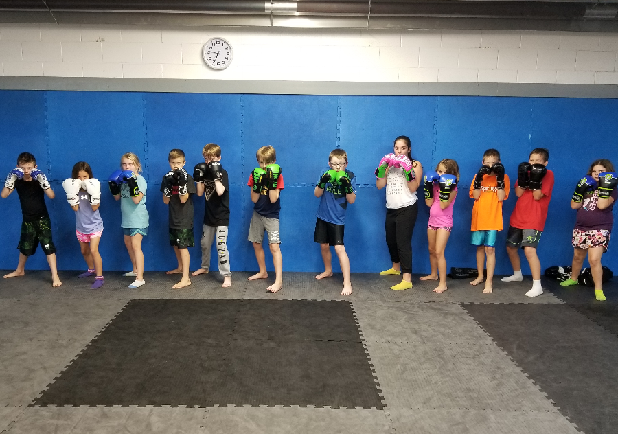 Kids Kickboxing Muay Thai Karate Boxing Self Defense Fitness Class Chatham Martial Arts youth children classes training bully bullies bullying mma boxing education ckont sport gym